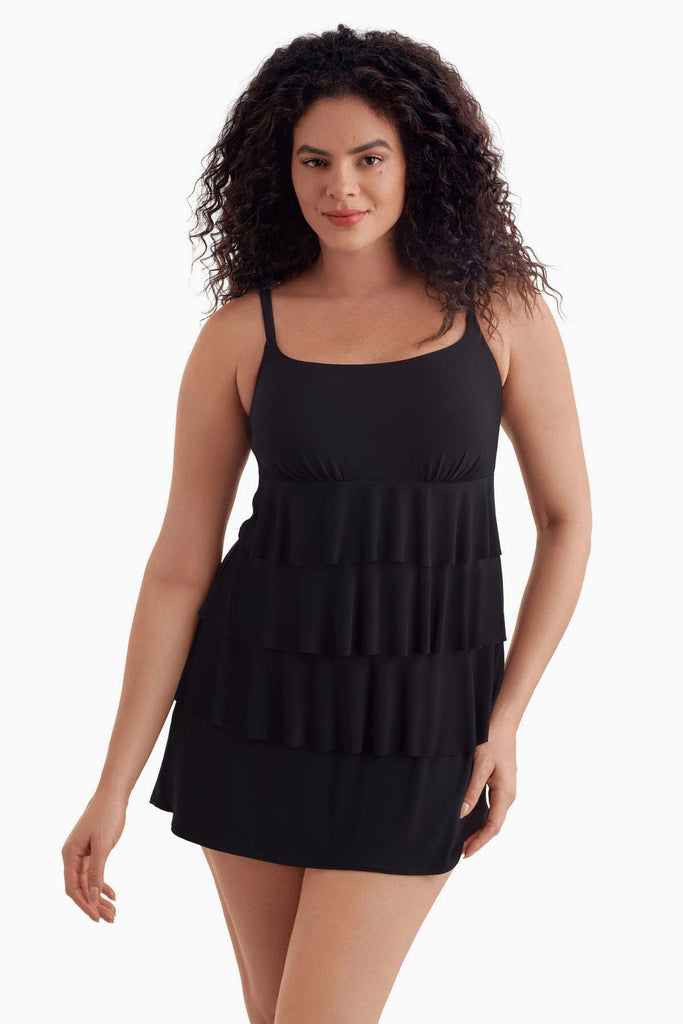 Woman wearing a black tiered swim dress