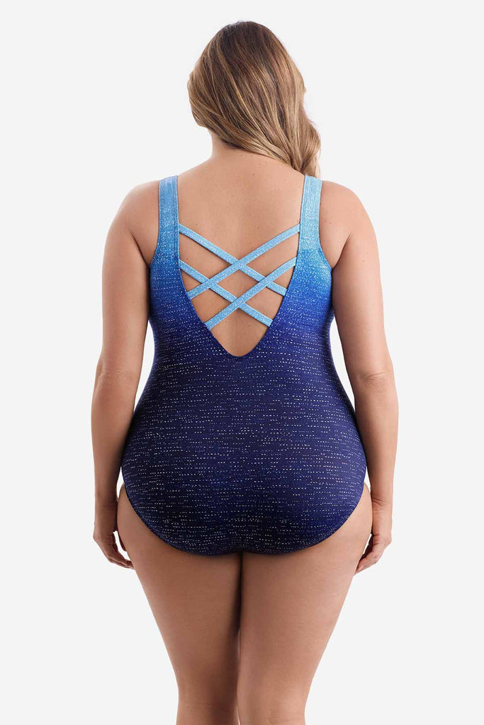 Woman turned away wearing a blue ombre one-piece swimsuit