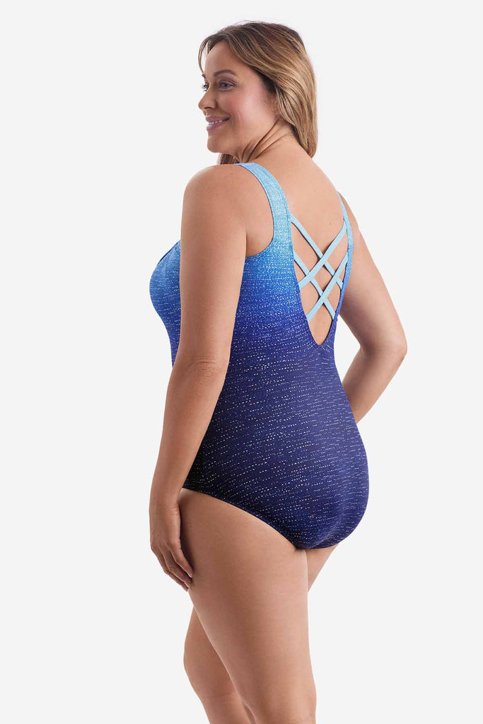 Woman turned left wearing a blue ombre one-piece swimsuit