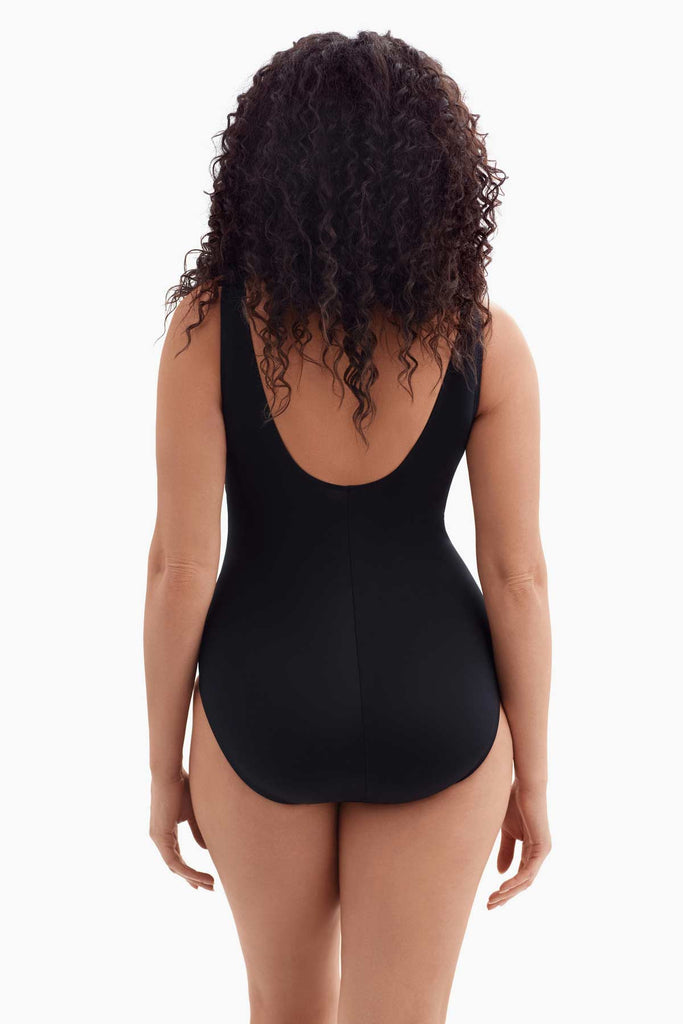 Woman turned away wearing a one-piece swimsuit