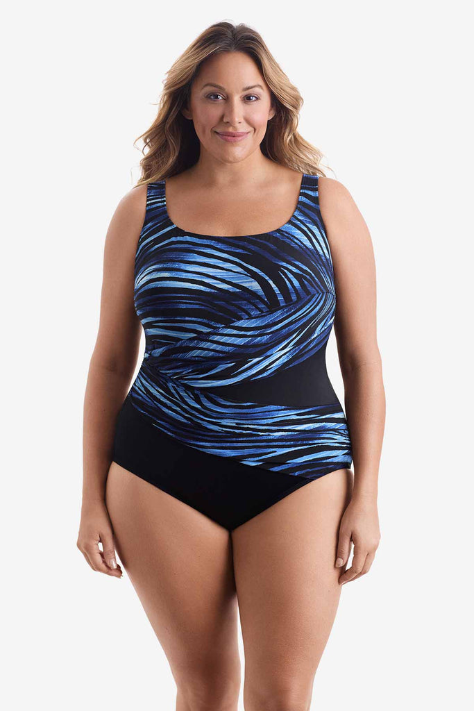 Woman wearing a swimsuit with a black and blue swoop pattern