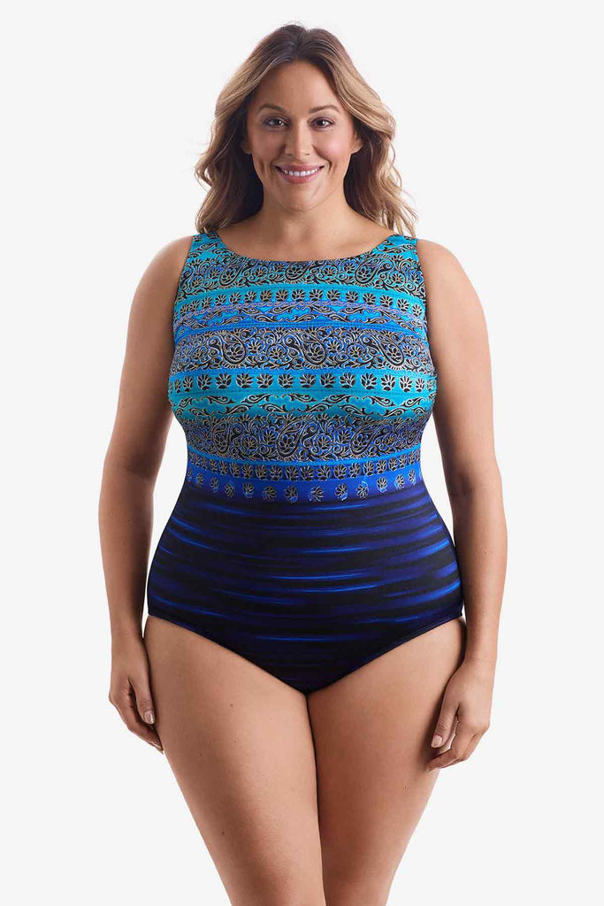 Woman wearing a one-piece swimsuit with a multi pattern blue print