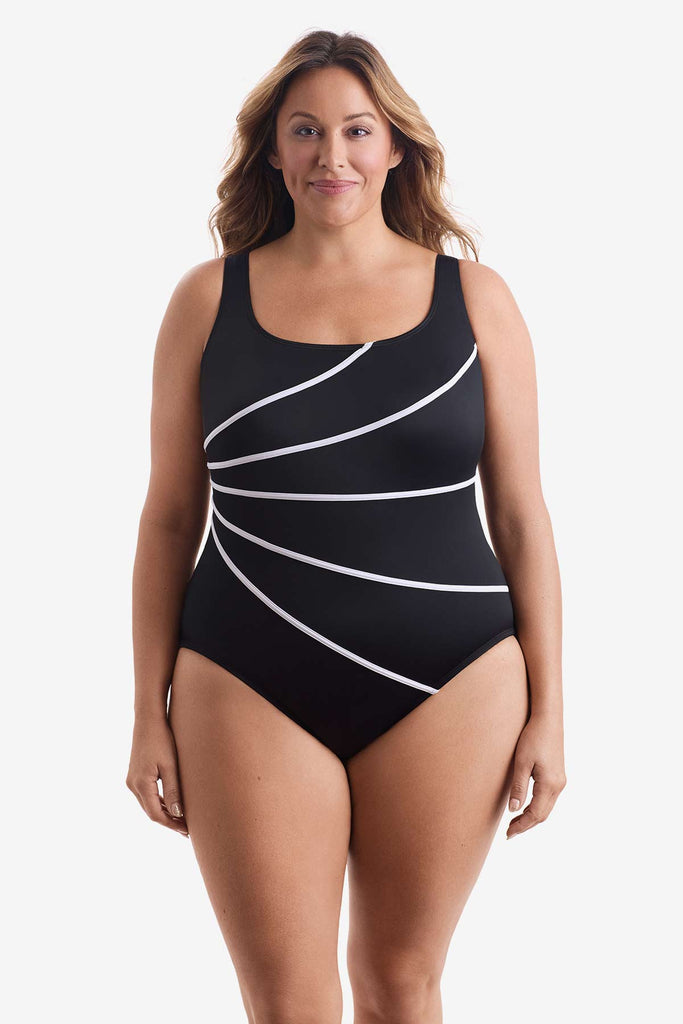 Woman wearing a one-piece swimsuit with four white streaks on the front