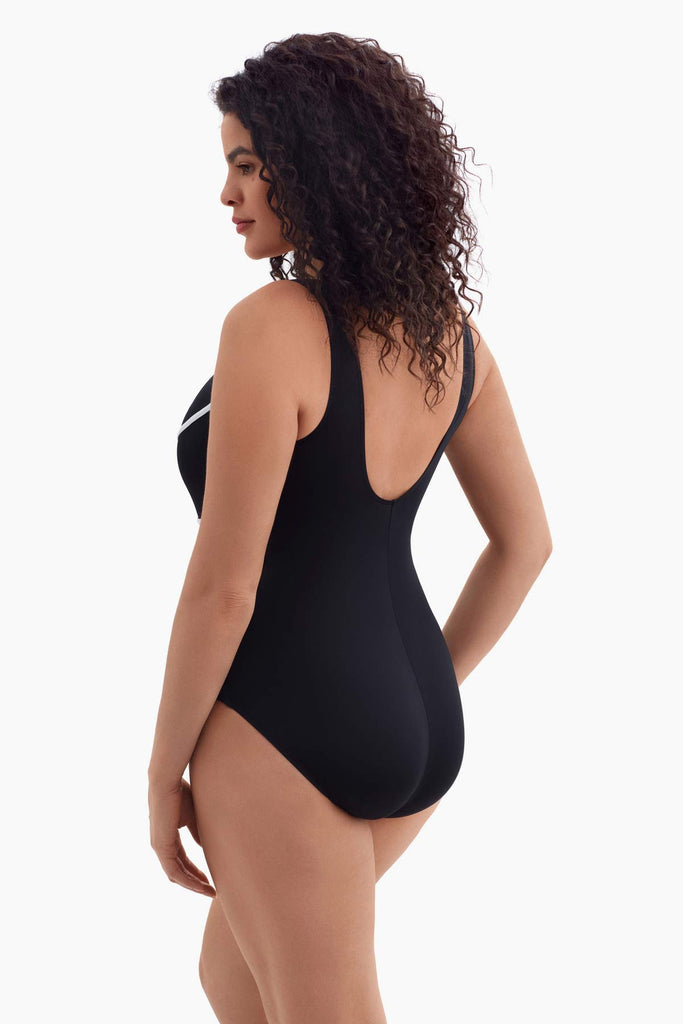 Woman facing left to detail of one-piece swimsuit