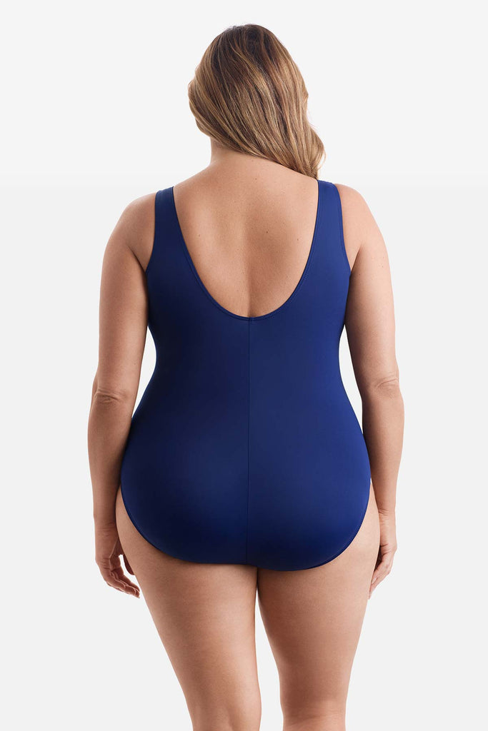 Woman faced away wearing a one-piece swimsuit 