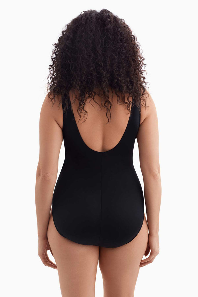 Woman turned away wearing a one-piece swimsuit