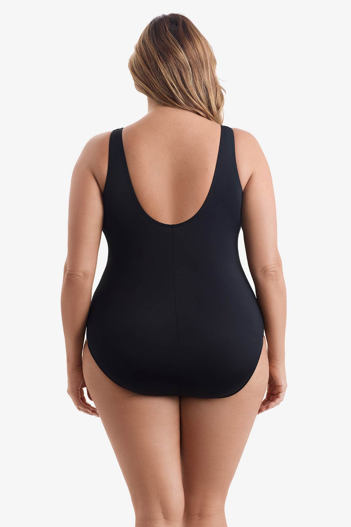 Woman faced away wearing one-piece swimsuit 