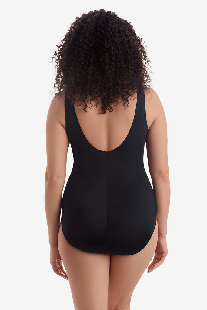 Woman faced away wearing a one-piece swimsuit 