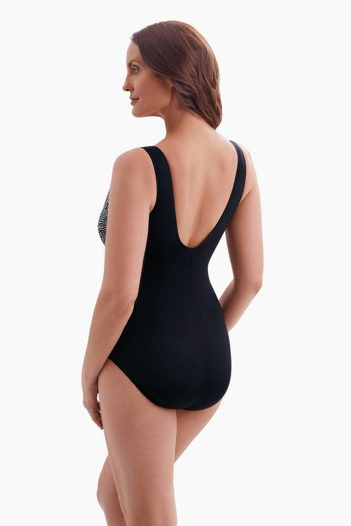 Woman faced left wearing a one-piece swimsuit