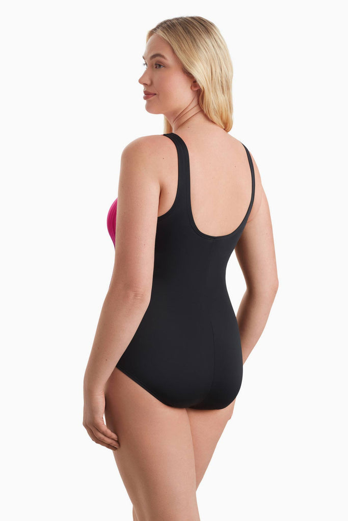 Woman turned away to show detail of onepiece swimsuit