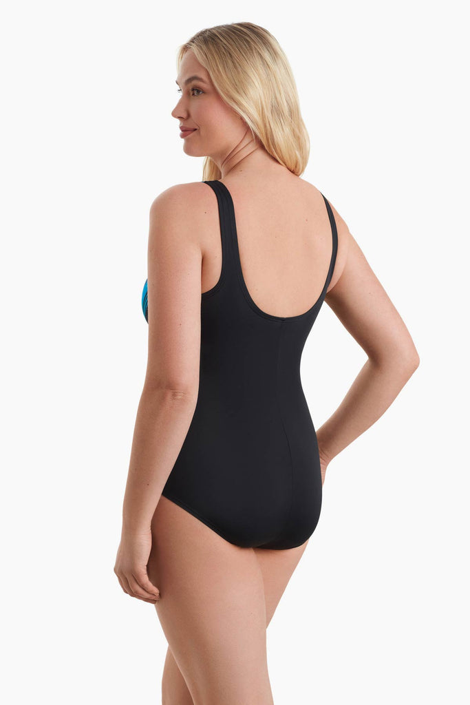 Woman facing to the left to show off detail of swimsuit