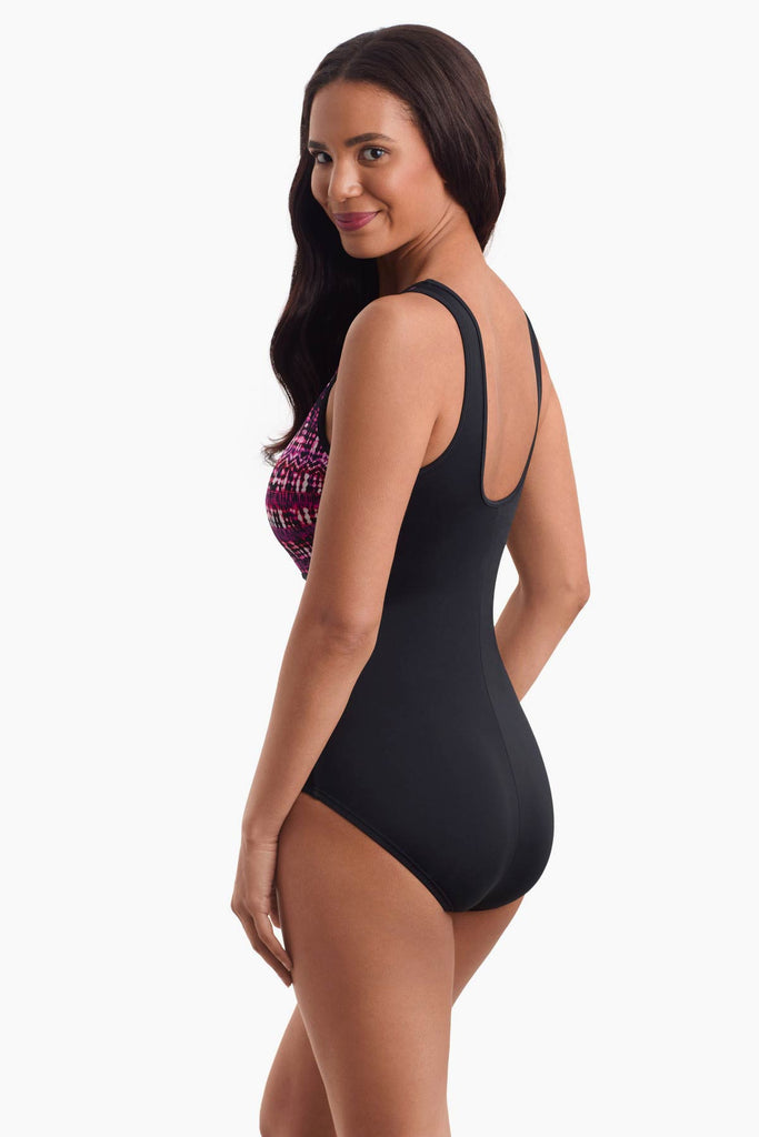 Woman turned to the left to show off side detail of swimsuit