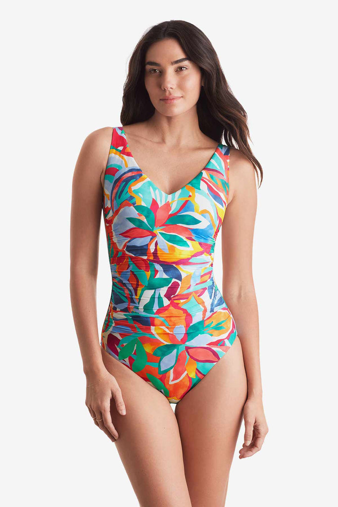 Woman wearing a multicolor floral one-piece swimsuit