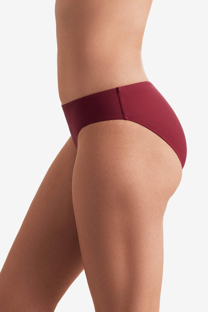 Side of dark red swim bottoms