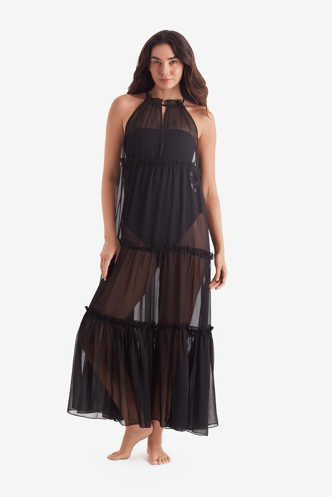 Woman wearing a black sheer swim dress cover up