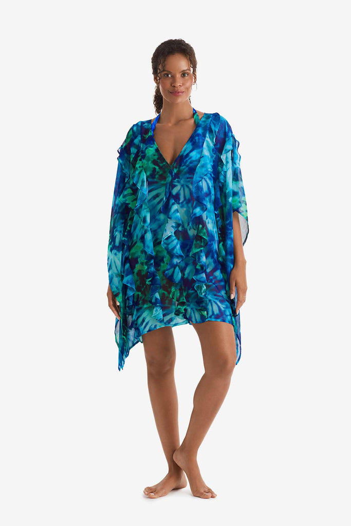 Woman wearing a blue and green tie dye swim poncho cover up 