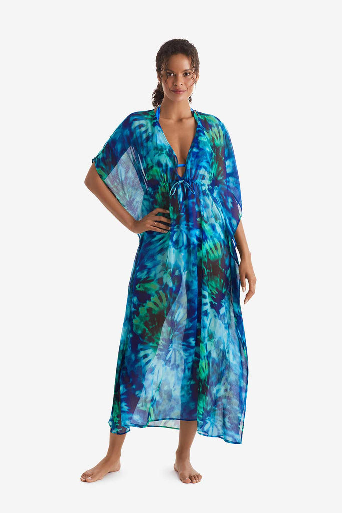 Woman wearing a blue and green tie dye caftan swim dress cover up