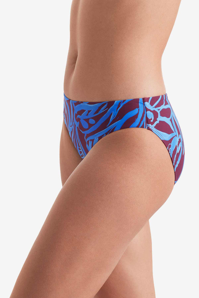 Side of blue and brown abstract printed swim bottoms