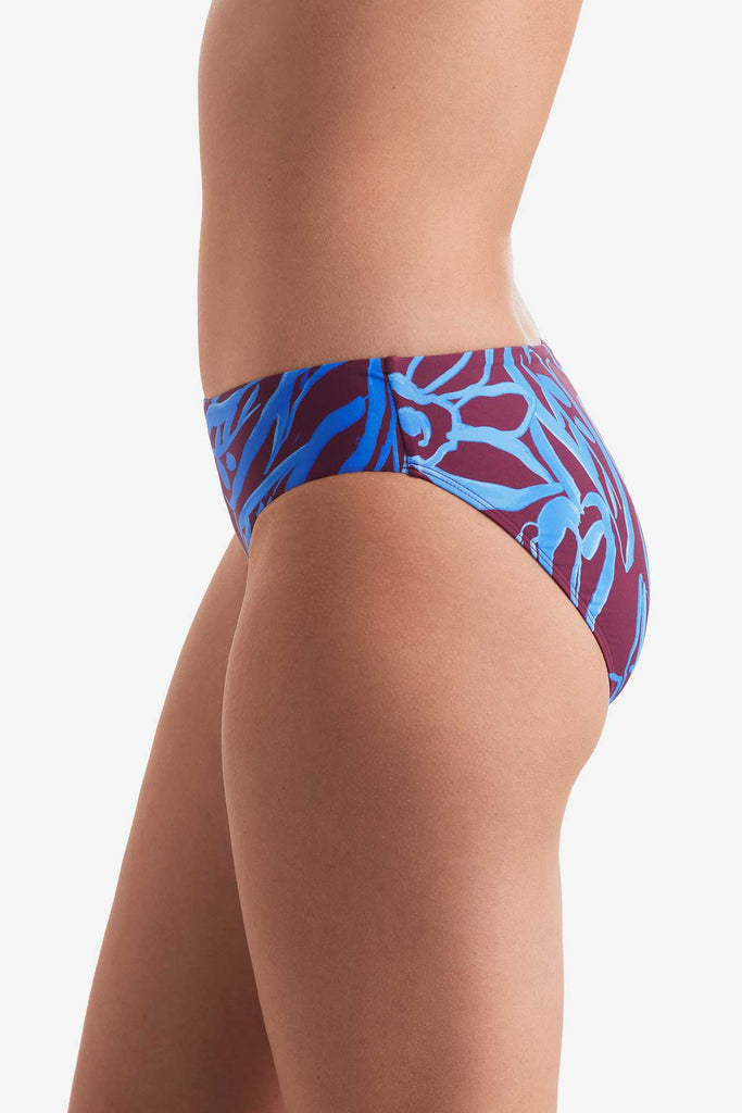 Side of blue and brown abstract printed swim bottoms