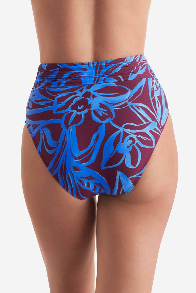 Back of high waisted blue and brown abstract floral printed swim bottoms