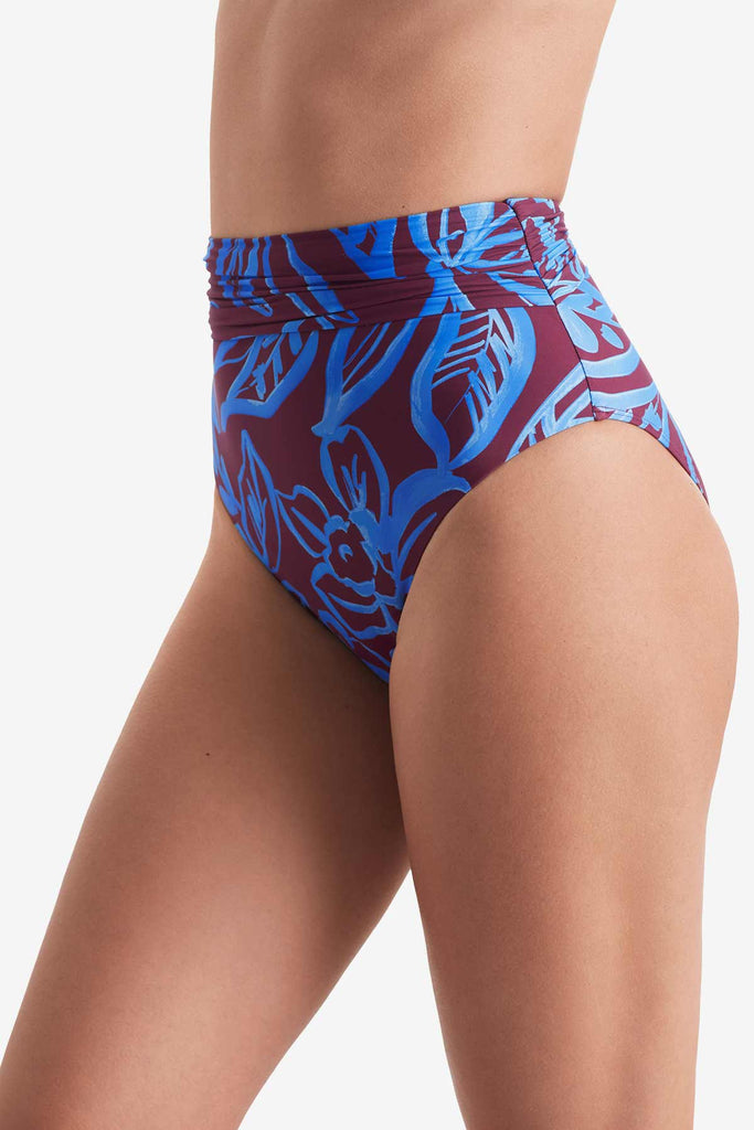 Side of high waisted blue and brown abstract floral printed swim bottoms